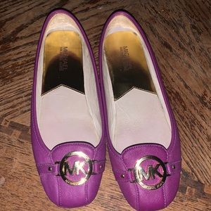 MK purple loafers with gold emblem